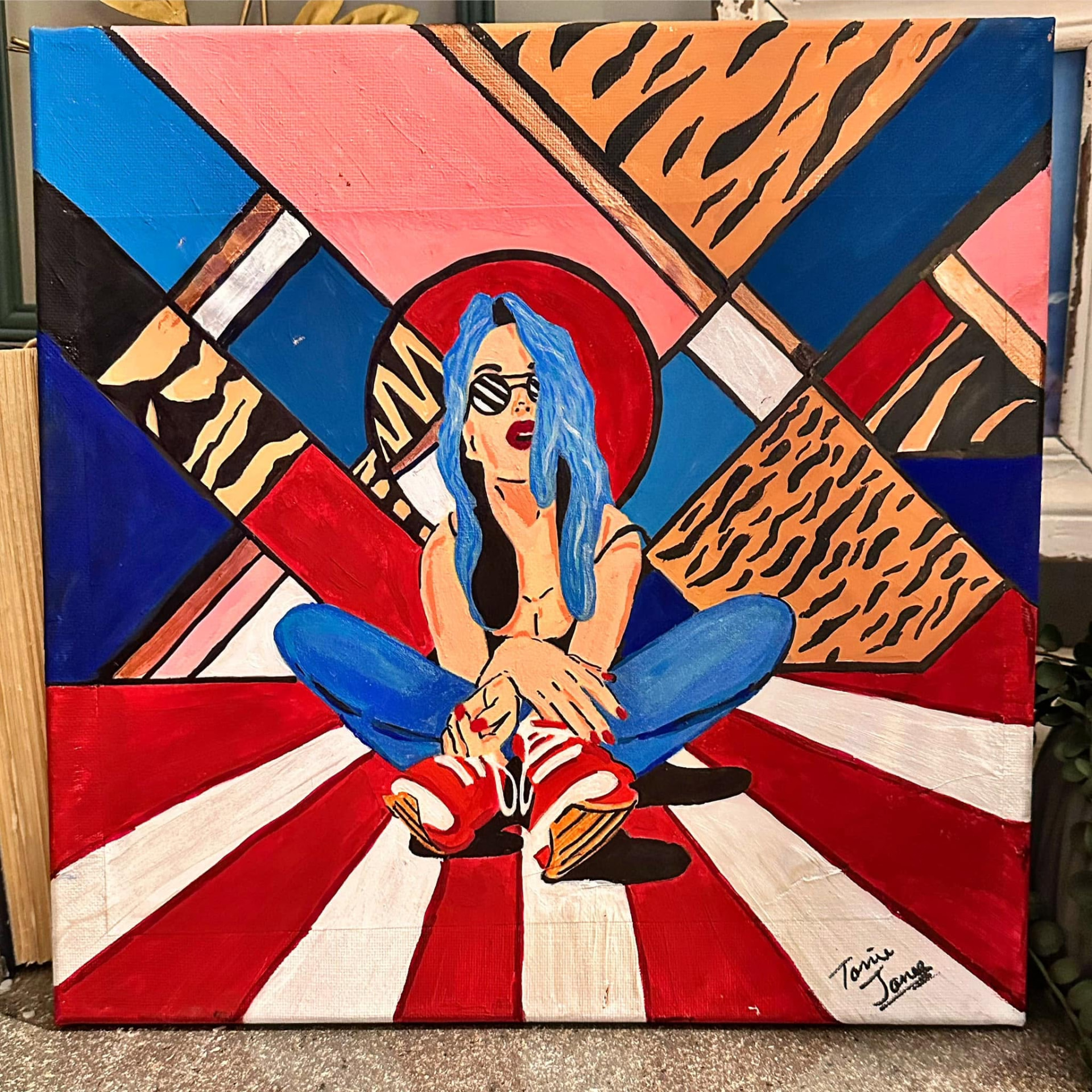 Stripes — original painting of a blue-haired woman over bold geometric red, white, blue, and tiger-print shapes, signed by Torrie Jones