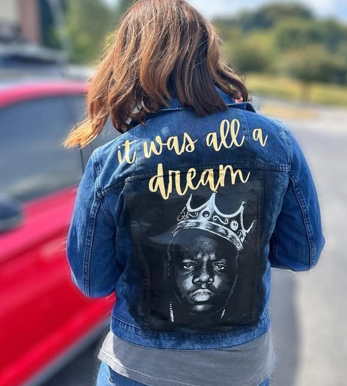Denim jacket hand-painted with a crowned portrait and 'it was all a dream' lettering